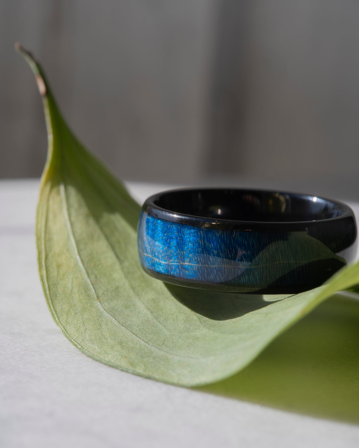 8 mm Wide Dyed Azure Wood Inlay Band with a Comfort Fit Interior in Black Plated Tungsten at a Size 10