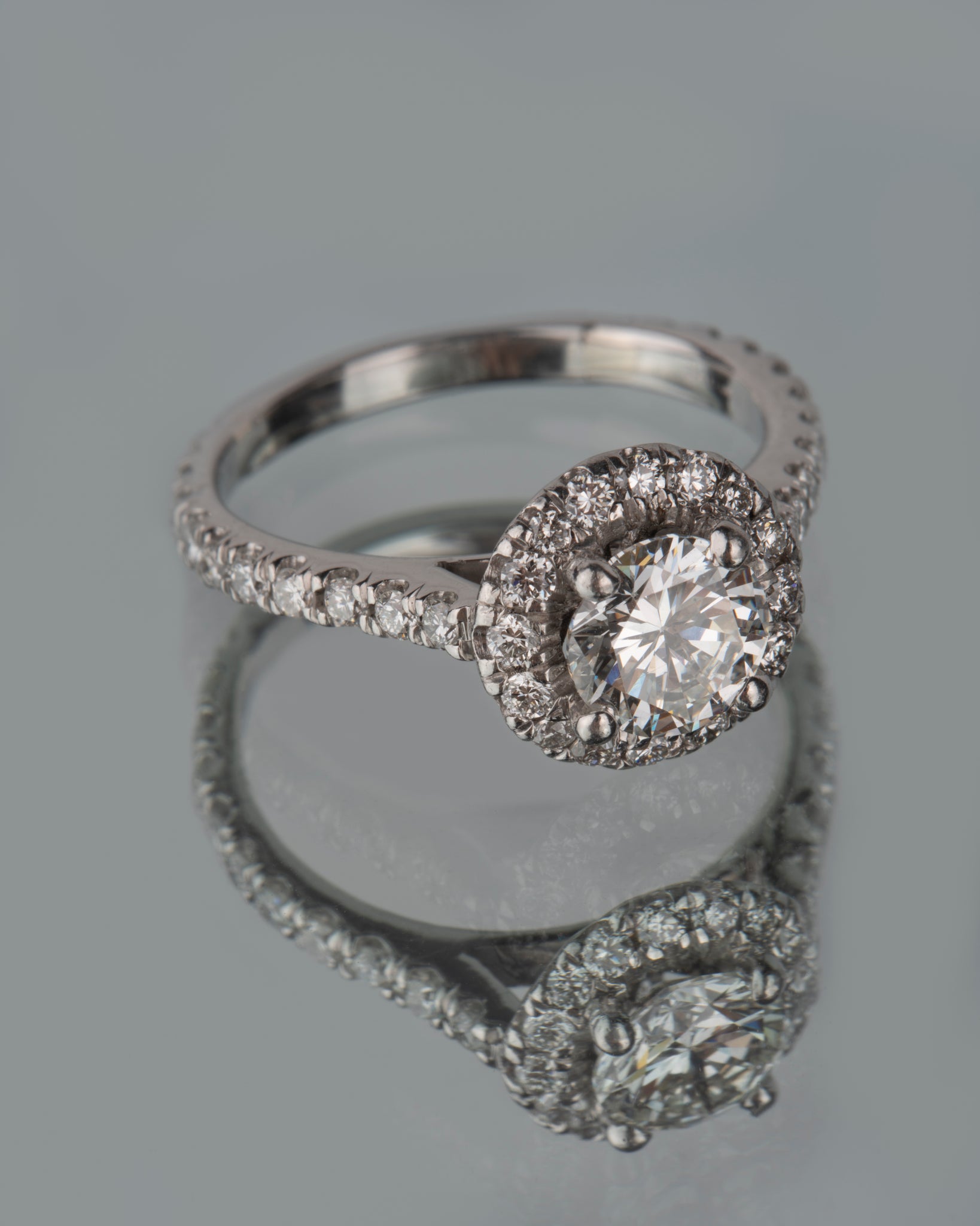 3/4 ct Natural VS2 H Color Diamond with a Round Diamond Halo Ring in Platinum 950 at a Size 7