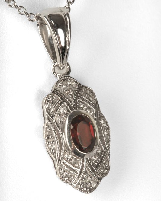 .63 ct. Oval Cut Garnet & Topaz Pendant in Sterling Silver with an 18" Cable Chain in Sterling Silver