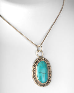 Oblong Turquoise Cabochon Bezel Set Pendant with Chain in 925 Sterling Silver at 24"