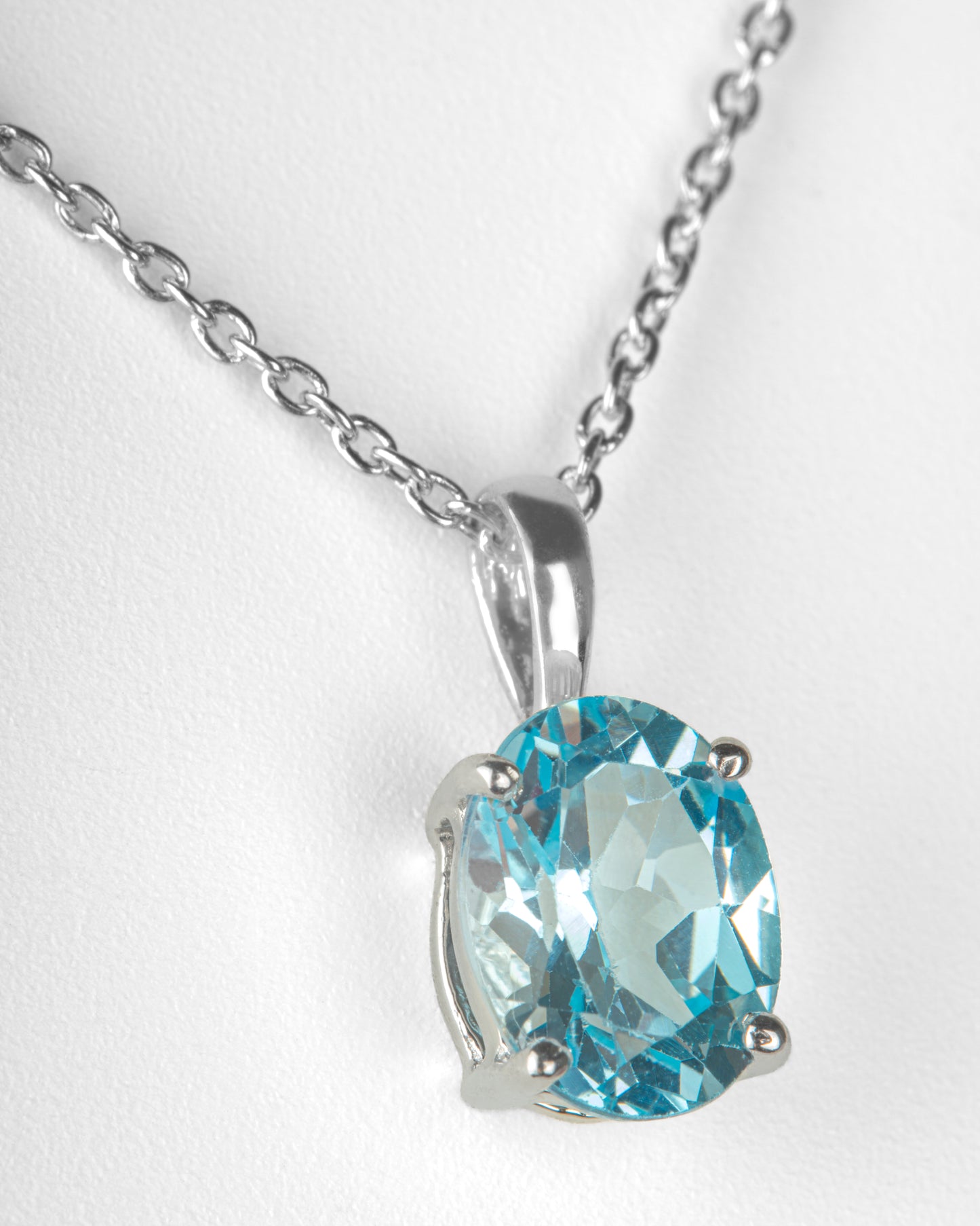 2 ct. Oval Blue Topaz Solitaire Basket Pendant in Sterling Silver with an 18" Cable Chain in Sterling Silver