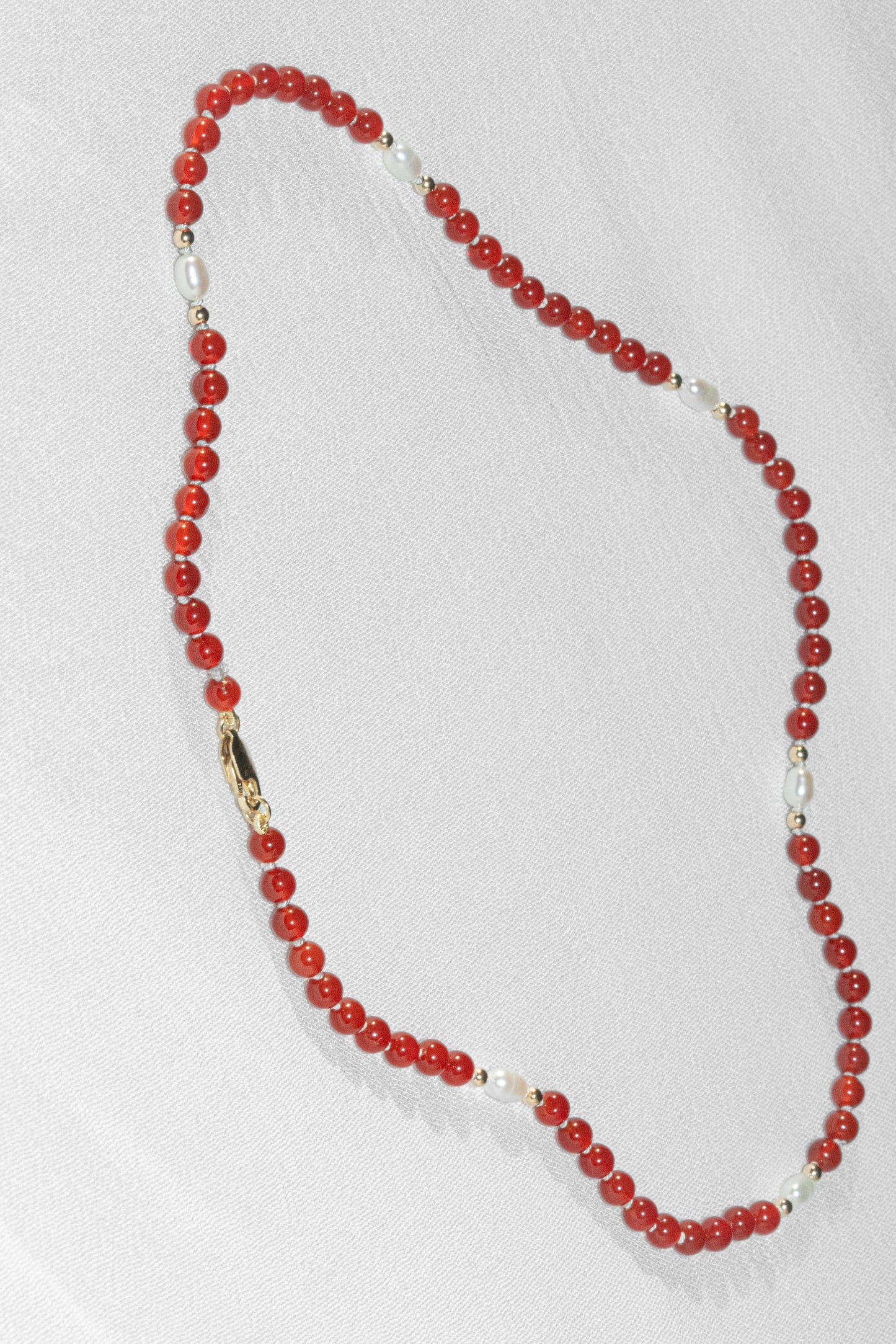 SJG Sunset Necklace with a 14K Yellow Gold Clasp at 16" with Carnelian, Rice Pearls and Gold Beads