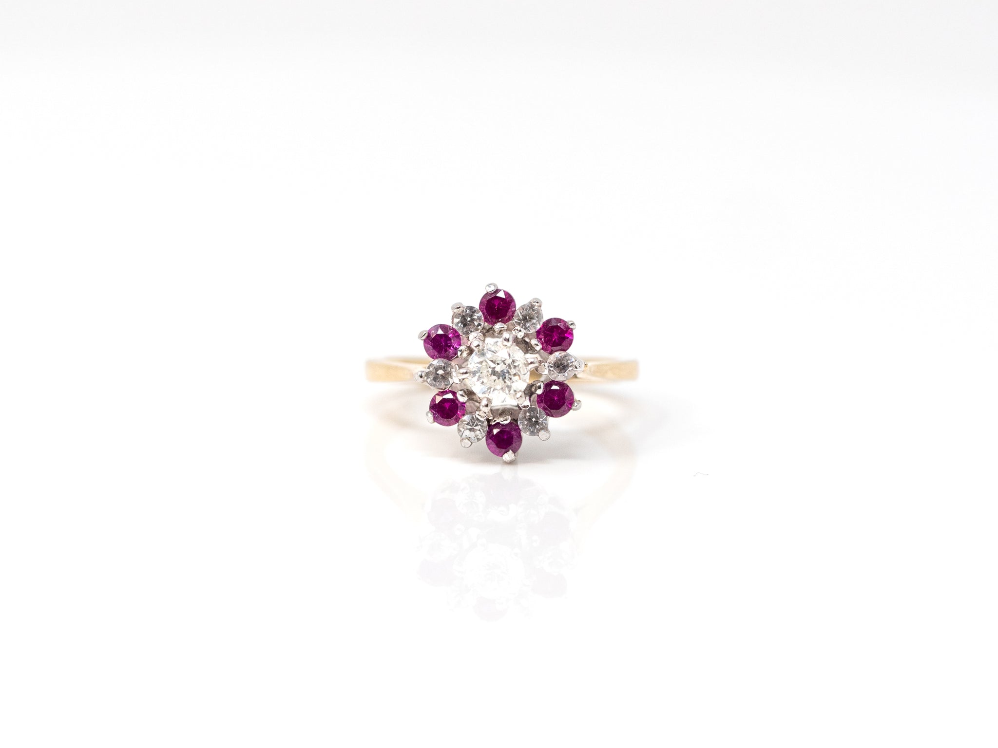 Natural Center 1/4 ct. Round Diamond with 0.2 ctw. Round Diamond & 0.4 ctw. Round Ruby Halo Cathedral Ring in 14K White and Yellow Gold at a Size 5 1/4